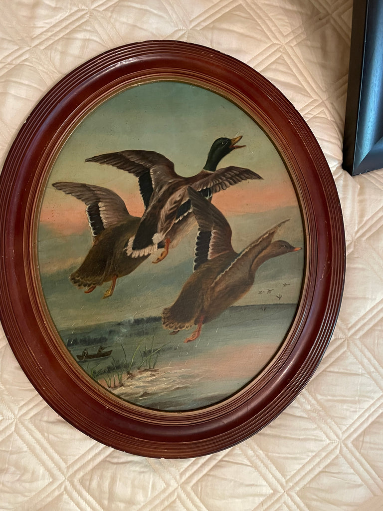 Oval antique oil painting of mallards