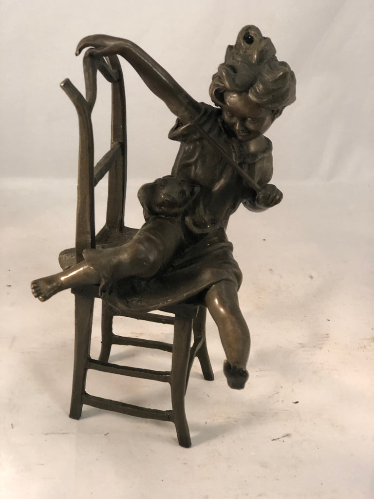 Bronze of girl with cat